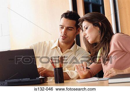 Man and woman with laptop View Large Photo Image Stock Photograph - Man and woman with laptop. Fotosearch