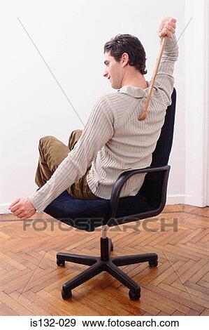 Stock Photo - Man scratching back. Fotosearch