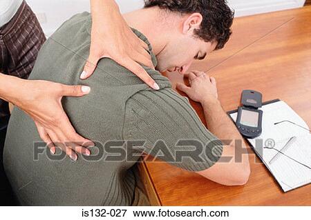 Stock Photo - Woman massaging man. Fotosearch