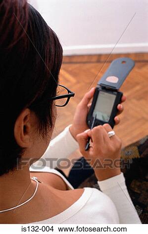 Woman using handheld computer View Large Photo Image Picture - Woman using handheld computer. Fotosearch