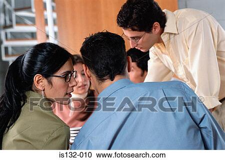 Stock Image - Woman whispering to man. Fotosearch