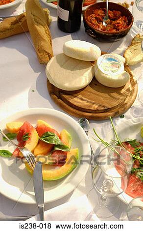 Stock Photo - Cheeses and melon slices. Fotosearch