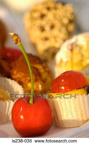 Stock Photography - Cherry with cakes. Fotosearch