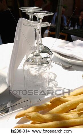 Picture - Wine glasses by breadsticks. Fotosearch
