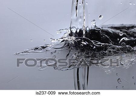 Pouring water View Large Photo Image Stock Photo - Pouring water. Fotosearch