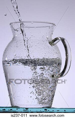 Water pouring into jug View Large Photo Image Stock Image - Water pouring into jug. Fotosearch