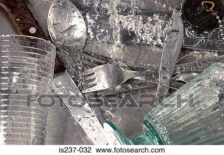 Stock Image - Wet cutlery in sink. Fotosearch