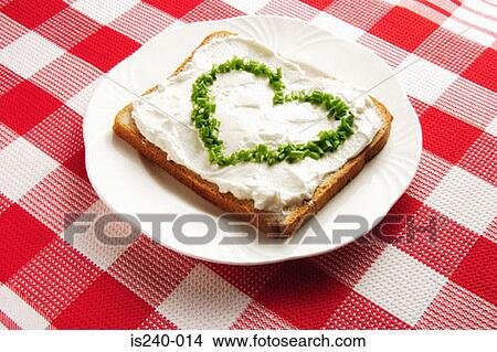 Picture - Chives in heart shape on sandwich . Fotosearch