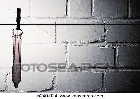 Condom hanging on clothesline View Large Photo Image Picture - Condom hanging on clothesline. Fotosearch