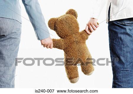 holding a teddy bear
