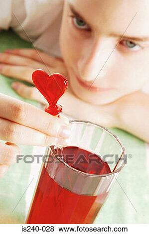 Girl with heart shaped straw View Large Photo Image Stock Photo - Girl with heart shaped straw. Fotosearch