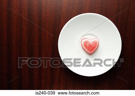 Stock Photo - Heart shaped sweet on plate. Fotosearch