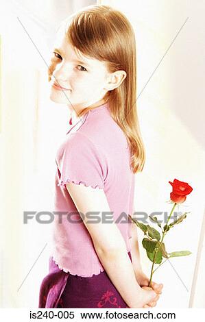 Smiling girl holding red rose View Large Photo Image Stock Photography - Smiling girl holding red rose. Fotosearch