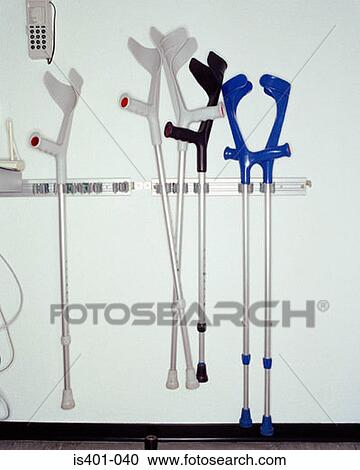 Crutches hanging on wall View Large Photo Image Stock Image - Crutches hanging on wall. Fotosearch