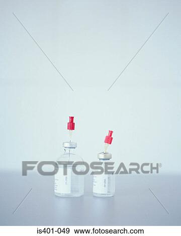 Hypodermic needles in bottles View Large Photo Image Stock Photo - Hypodermic needles in bottles. Fotosearch