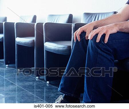 Man sitting in hospital waiting room View Large Photo Image Stock Photography - Man sitting in hospital waiting room. Fotosearch