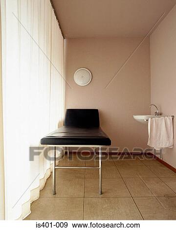 Stock Photo - Treatment couch in hospital. Fotosearch