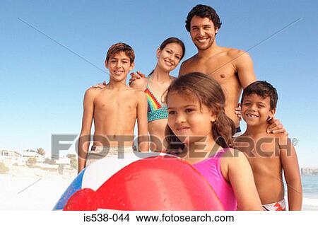 A family on a beach View Large Photo Image Picture - A family on a beach. Fotosearch