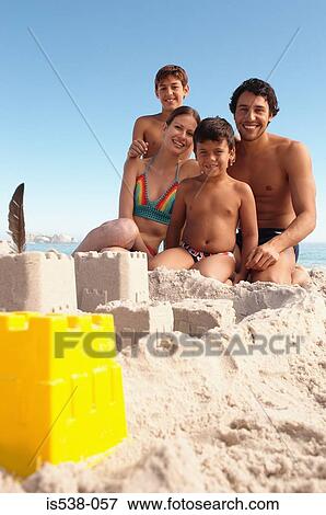 A happy family on a beach View Large Photo Image Stock Photo - A happy family on a beach. Fotosearch