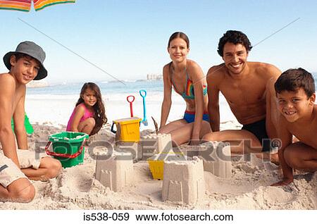 A happy family on a beach View Large Photo Image Stock Photo - A happy family on a beach. Fotosearch
