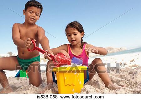 Children playing on the beach View Large Photo Image Stock Photo - Children playing on the beach. Fotosearch