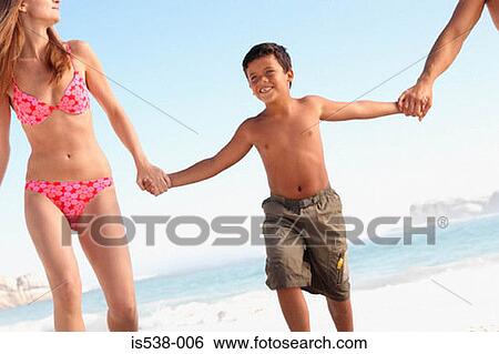 Stock Photograph - Happy boy on a beach. Fotosearch