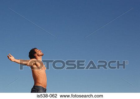 Man with his arms wide open View Large Photo Image Stock Image - Man with his arms wide open. Fotosearch