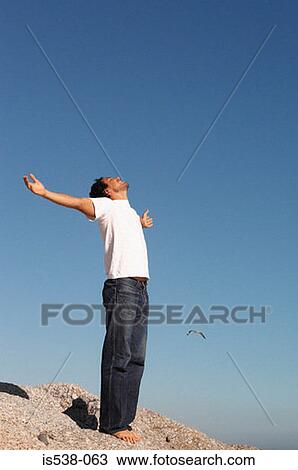 Man with his arms wide open View Large Photo Image Stock Image - Man with his arms wide open. Fotosearch