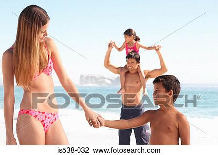 Mum and son holding hands on a beach View Large Photo Image Stock Image - Mum and son holding hands on a beach. Fotosearch