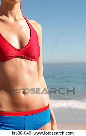 Stock Photograph - Woman on a beach. Fotosearch
