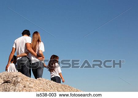 Young family on a sunny day View Large Photo Image Stock Image - Young family on a sunny day . Fotosearch