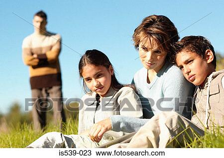 Family relaxing in field View Large Photo Image Stock Image - Family relaxing in field. Fotosearch