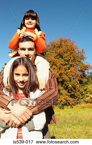 Father and daughters hugging View Large Photo Image Stock Photo - Father and daughters hugging. Fotosearch