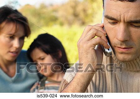 Picture - Man using mobile phone. Fotosearch