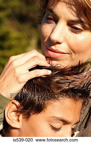 Mother hugging son View Large Photo Image Stock Image - Mother hugging son. Fotosearch
