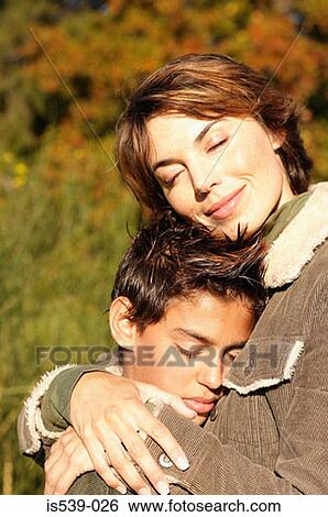 Mother hugging son View Large Photo Image Stock Photograph - Mother hugging son. Fotosearch