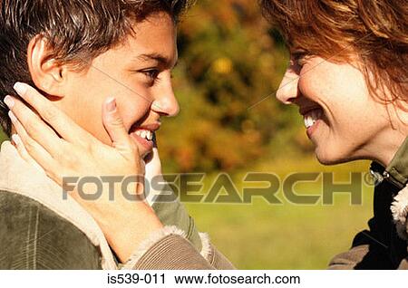 Profile of smiling mother and son View Large Photo Image Stock Image - Profile of smiling mother and son. Fotosearch