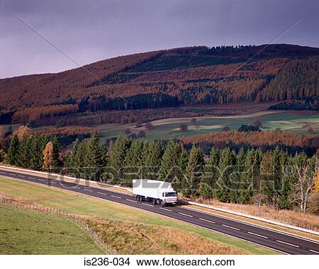 Picture - Road through countryside. Fotosearch