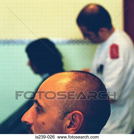 Barber cutting hair View Large Photo Image Stock Photograph - Barber cutting hair. Fotosearch