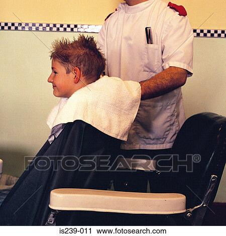 Barber drying boys hair View Large Photo Image Stock Image - Barber drying boys hair. Fotosearch
