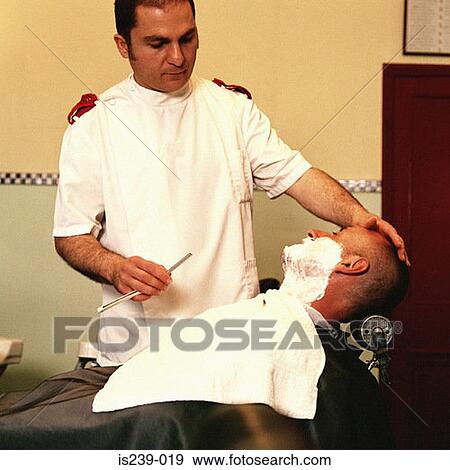 Barber shaving man View Large Photo Image Stock Photo - Barber shaving man. Fotosearch