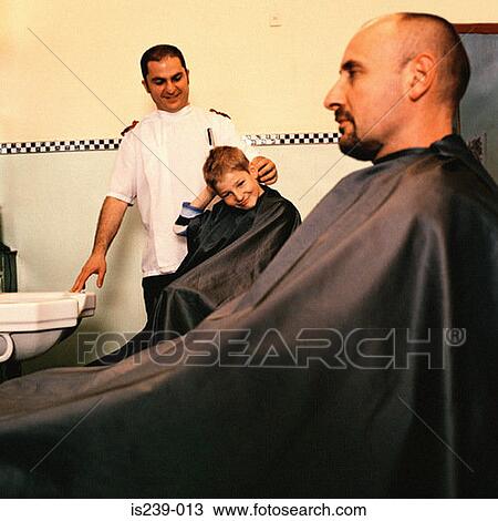 Boy and man at barbers View Large Photo Image Stock Image - Boy and man at barbers. Fotosearch