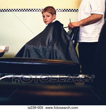 Stock Photography - Boy at barbers. Fotosearch