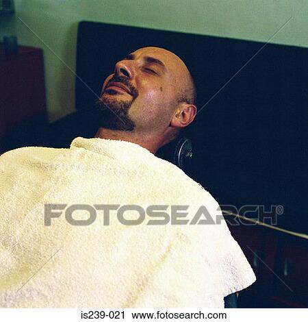 Man reclining at barbers View Large Photo Image Stock Image - Man reclining at barbers. Fotosearch