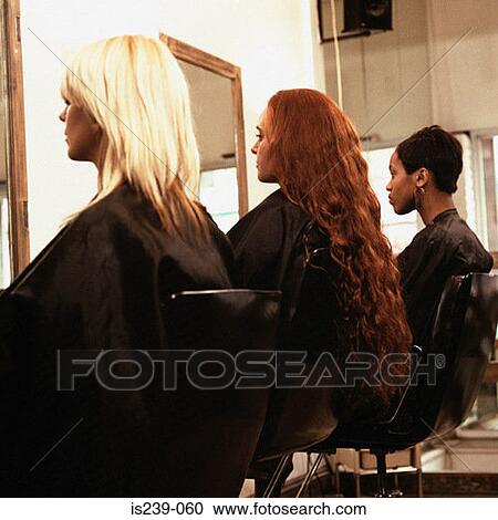 Stock Image - Three women at hairdressers. Fotosearch