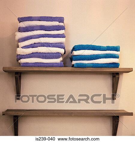 Towels stacked on shelves View Large Photo Image Stock Image - Towels stacked on shelves. Fotosearch