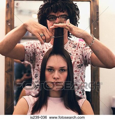 Woman having haircut View Large Photo Image Stock Photograph - Woman having haircut. Fotosearch