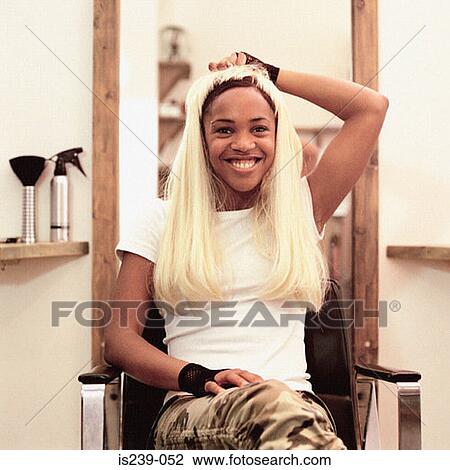 Woman wearing wig View Large Photo Image Stock Image - Woman wearing wig. Fotosearch