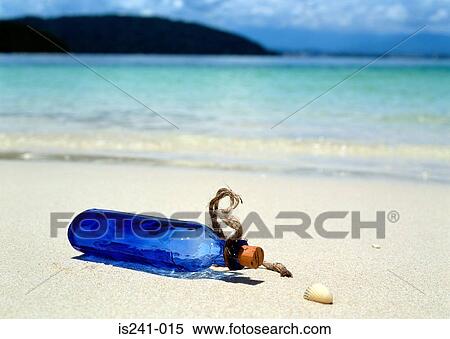 Blue bottle on beach View Large Photo Image Stock Photography - Blue bottle on beach. Fotosearch