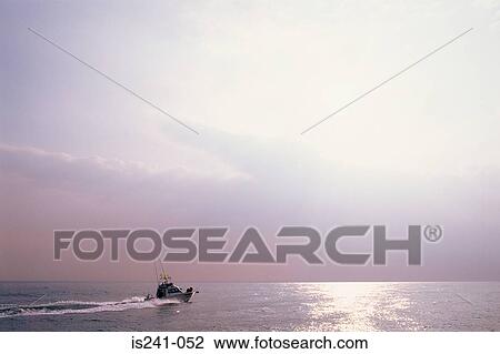 Stock Image - Fishing boat on ocean. Fotosearch